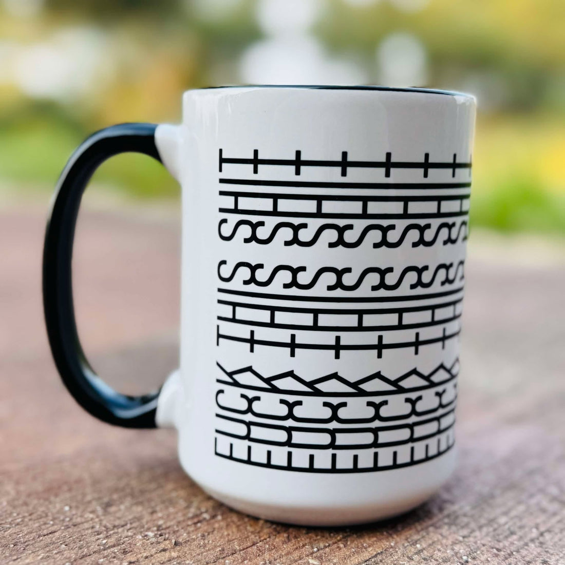 Ceramic mug that says &