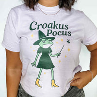 Graphic tee that says 'Croakus Pocus' with frogs in costume – funny Halloween shirt