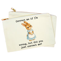 An off-white canvas zippered pouch featuring a vintage-style illustration of a rabbit in a blue dress with the text 'Correct me if I'm wrong, but did you just correct me?' on a plain white background.
