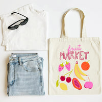 White t-shirt, blue jeans, black sunglasses, and a tote bag with fruit illustrations on a white background