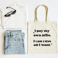 White tank top, blue jeans, black sunglasses, and a tote bag with text on a white background