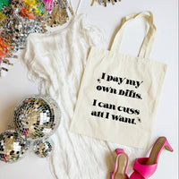 Tote bag with humorous text, disco balls, and high heels on a white background