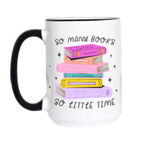 A white ceramic mug with a black handle and black rim, featuring a colorful graphic of stacked books and the text 'SO MANY BOOKS SO LITTLE TIME' on a plain white background.