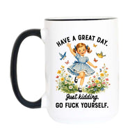 A white ceramic mug with a black handle and black rim, featuring a colorful illustration of a girl in a blue gingham dress surrounded by flowers and butterflies, with the text 'HAVE A GREAT DAY. Just kidding.