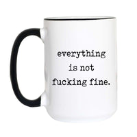 Funny sarcastic coffee mug with black typewriter text reading "everything is not fucking fine." on a white mug with black accent handle and rim
