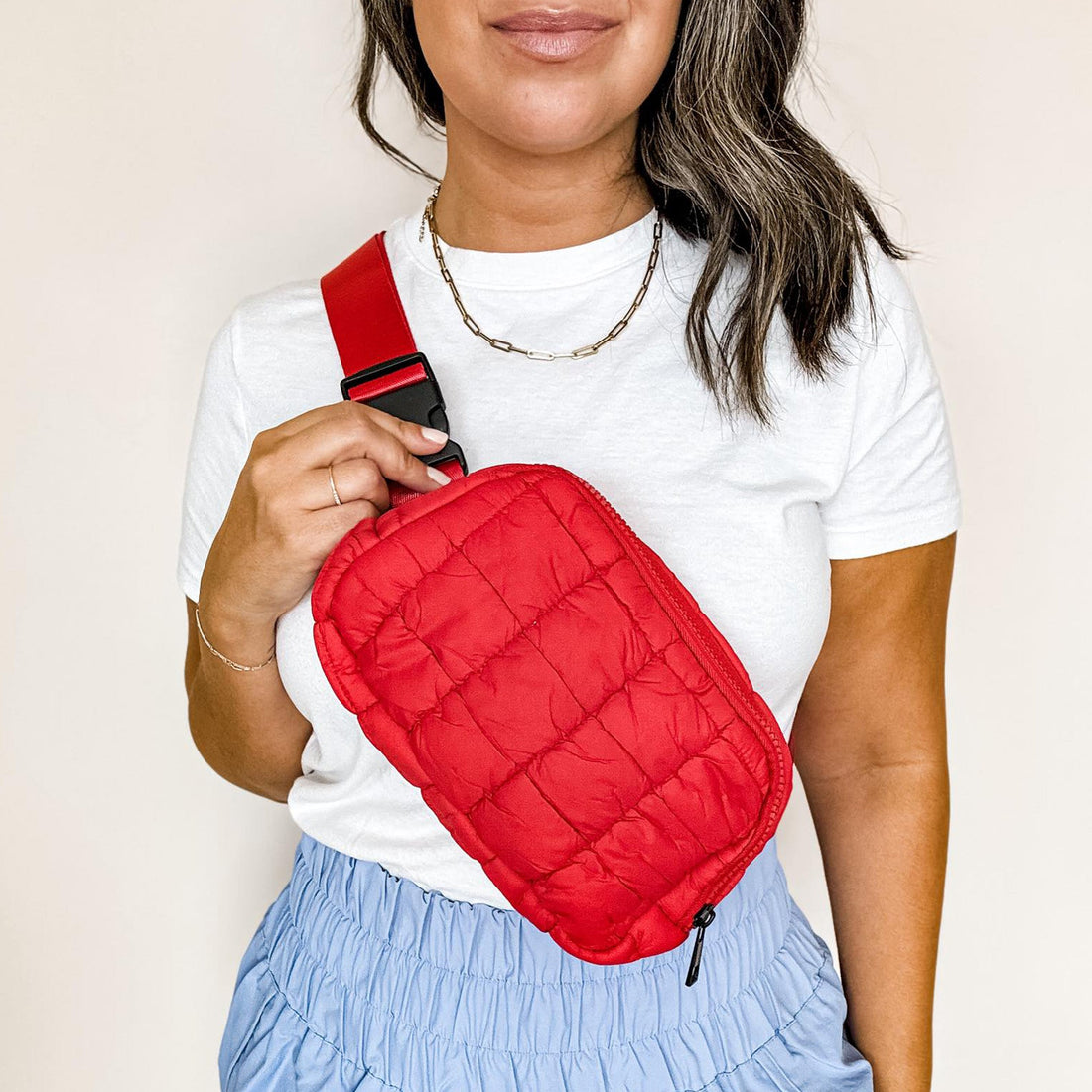 Red quilted puffer fanny pack with secure zip closure