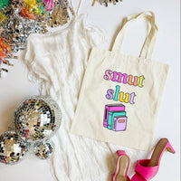 Tote bag with 'smut slut' text, disco balls, and high heels on a white background