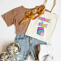 Brown t-shirt, denim shorts, gold scarf, disco ball, and tote bag with colorful text on a white background