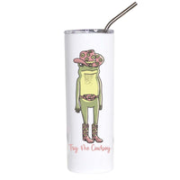A white insulated tumbler with a clear lid and metal straw, featuring a cartoon frog dressed in a pink cowboy hat, belt, boots, and vest, with the text 'Try Vibe Cowboy' printed below.