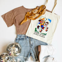 Brown t-shirt, denim shorts, gold scarf, and tote bag with graphic design on a white background