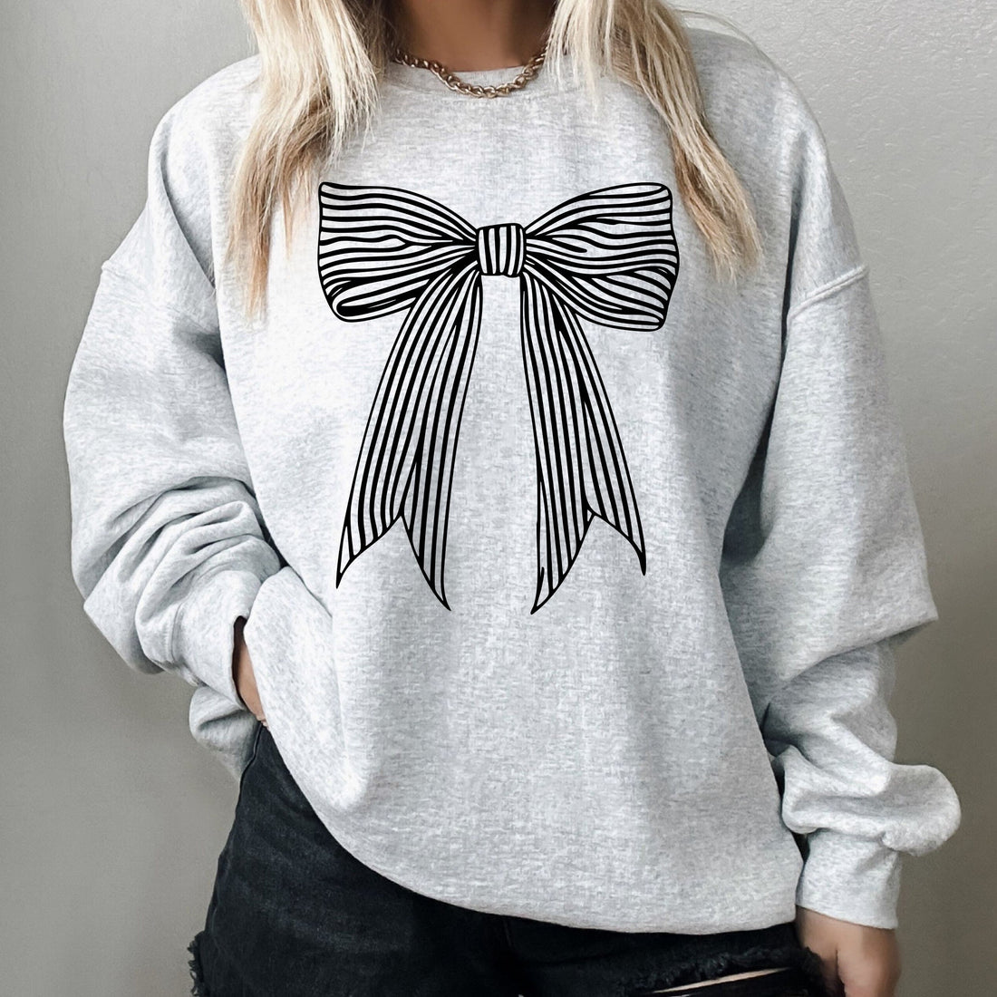 Heather ash sweatshirt with black striped coquette bow graphic – cozy trendy pullover