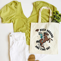 Green top, white pants, brown sandals, and tote bag with horse and text design on a white background