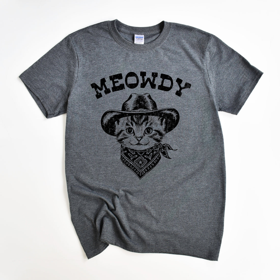 A gray t-shirt with a graphic print of a cowboy cat wearing a hat and bandana, and the text &