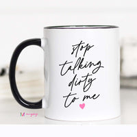White mug with black text 'stop talking dirty to me' and a pink heart on a white background
