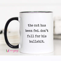 White mug with black text and black handle on a white background