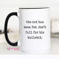 White mug with black text and handle on a white background