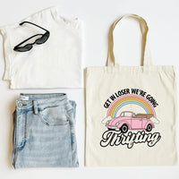 White tank top, blue jeans, sunglasses, and a tote bag with a car and rainbow design on a white background.