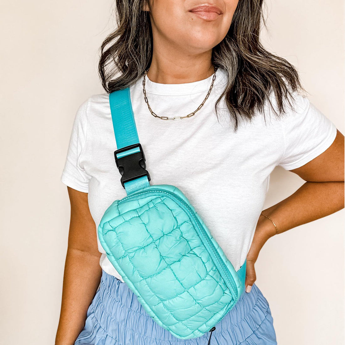 turquoise quilted crossbody bag for travel and everyday wear