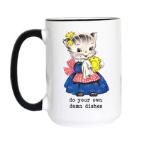 A white ceramic mug with a black handle and black rim, featuring a retro illustration of a kitten in a blue dress holding a yellow plate, with the text 'do your own damn dishes' printed below.