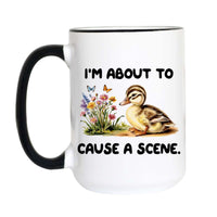Funny duck coffee mug featuring a vintage duckling surrounded by wildflowers with the quote "I'm About to Cause a Scene."