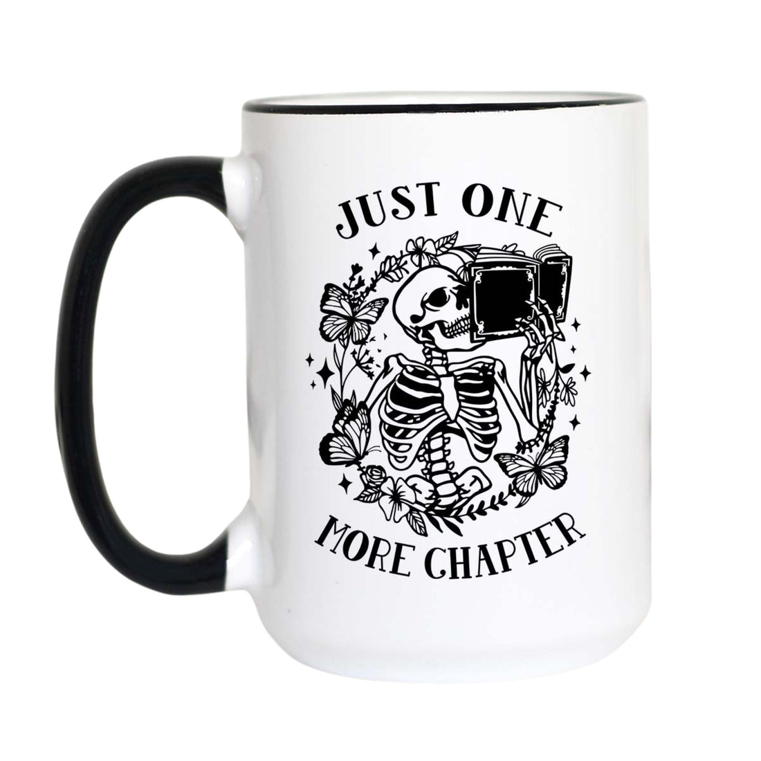 A white ceramic mug with a black handle and black rim, featuring a black graphic of a skeleton holding an open book surrounded by flowers, with the text &