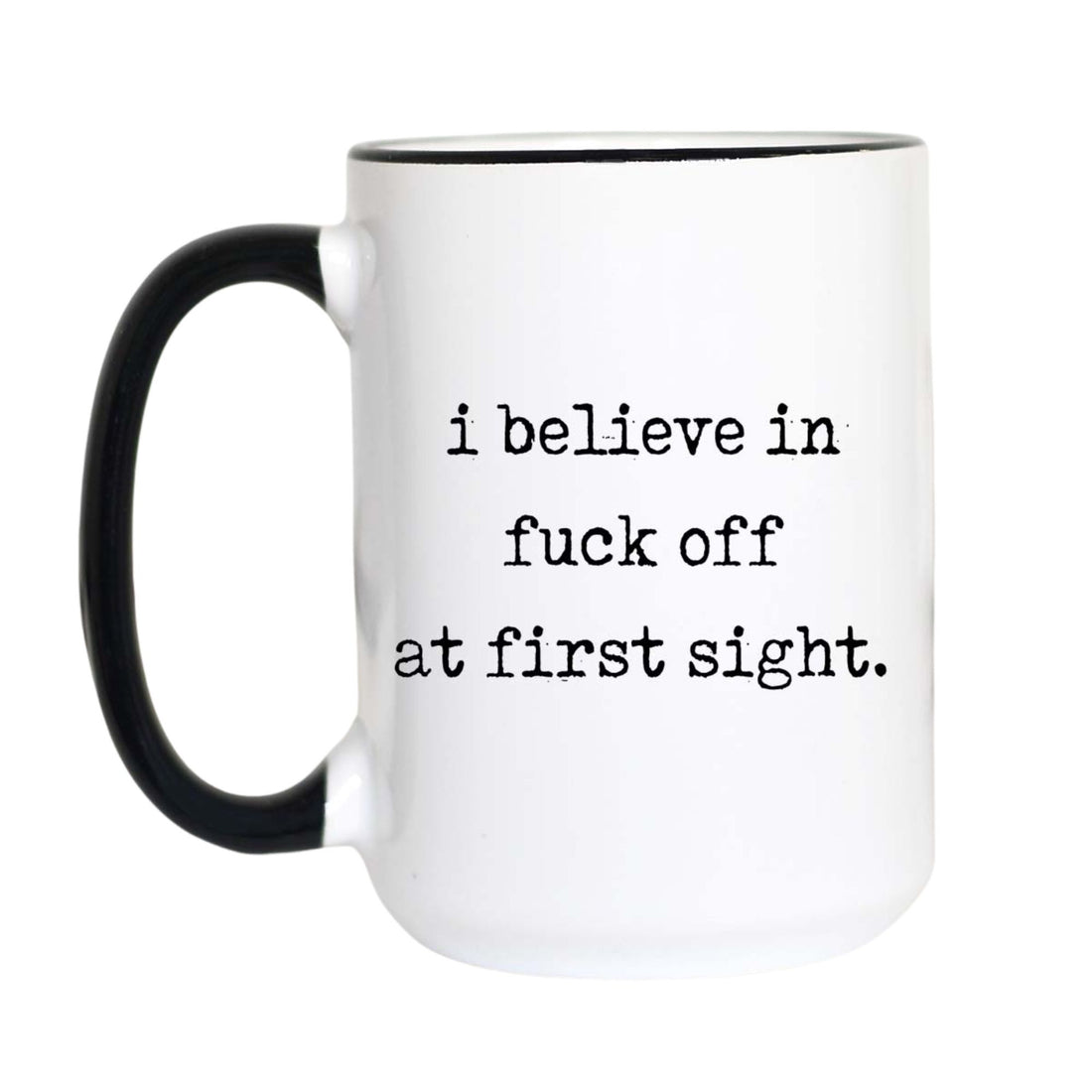 Funny introvert coffee mug with black typewriter text reading "i believe in fuck off at first sight." on a white mug with black accent handle and rim

