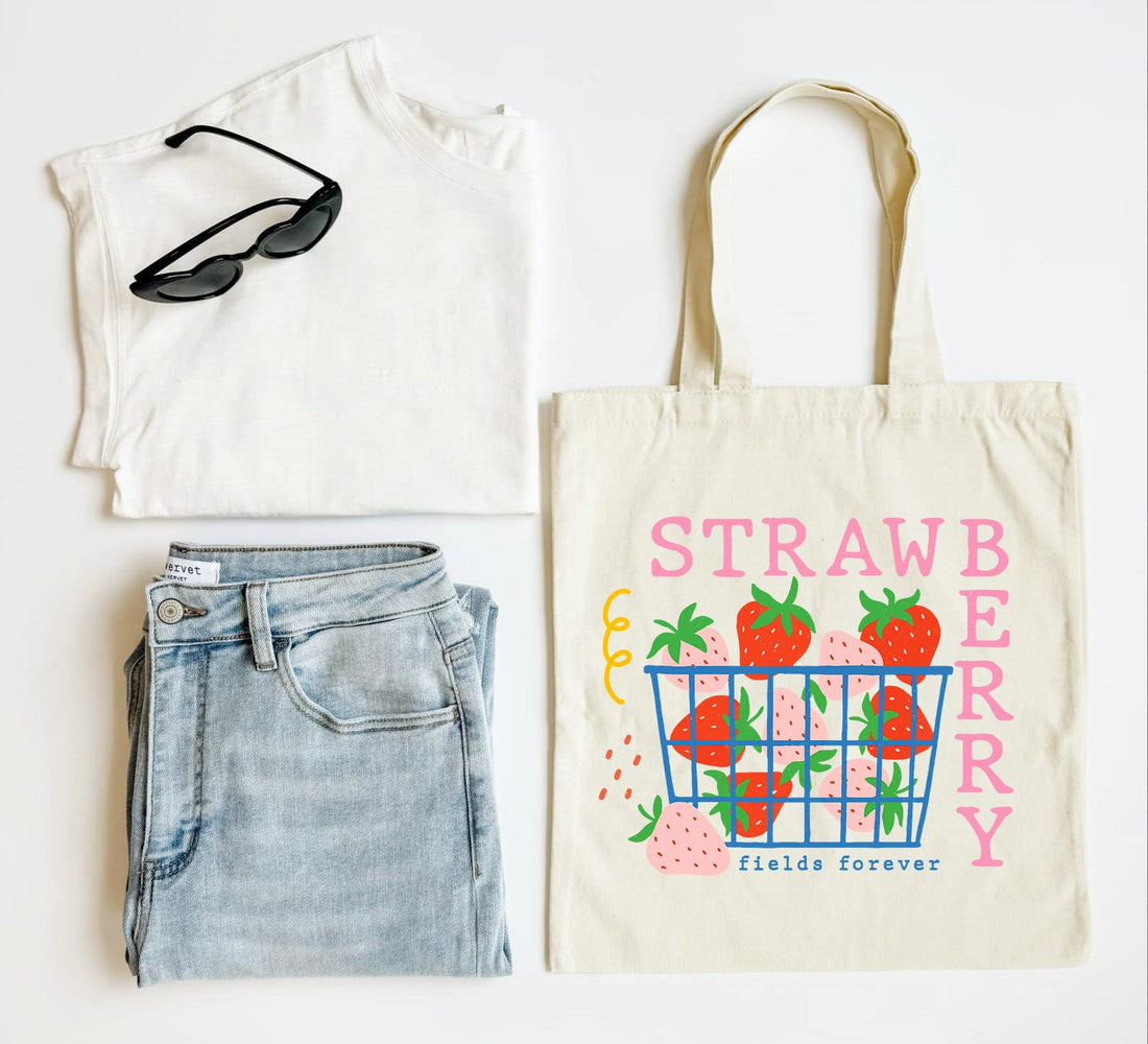 White tank top, blue jeans, sunglasses, and a tote bag with strawberry design on a white background
