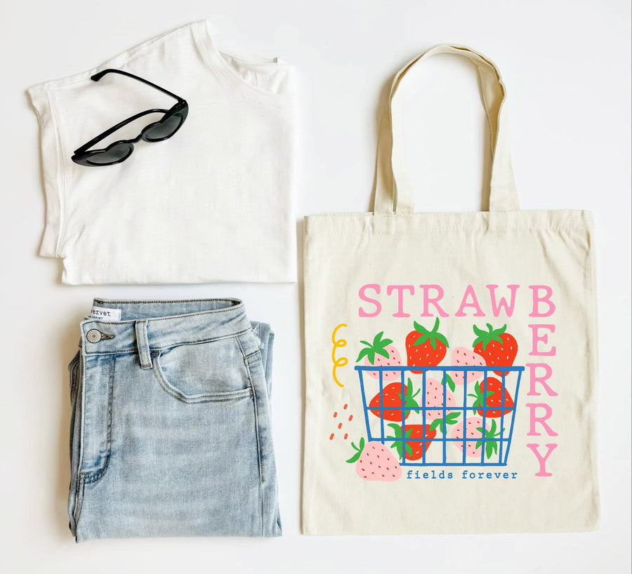 White tank top, blue jeans, sunglasses, and a tote bag with strawberry design on a white background