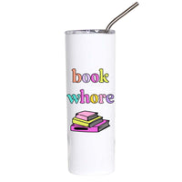 A white insulated tumbler with a clear lid and metal straw, featuring the text 'book whore' in multicolored bubble letters above a small illustration of stacked books, on a plain white background.
