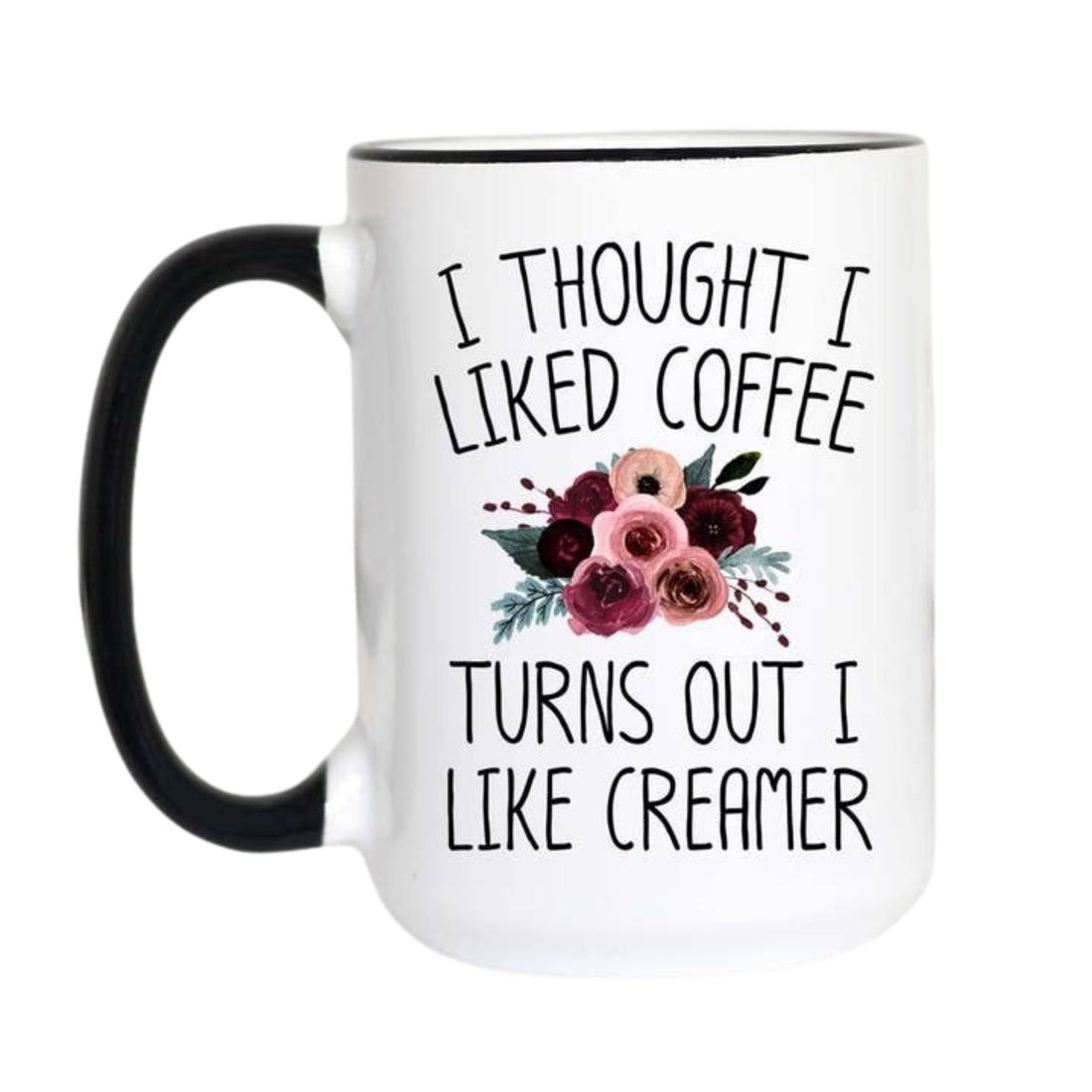 A white ceramic coffee mug with a black handle and black rim, featuring the printed text &