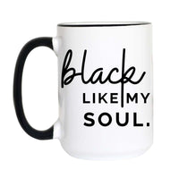 A white ceramic coffee mug with a black handle and black interior rim, featuring the printed text 'black LIKE MY SOUL.' on the front.