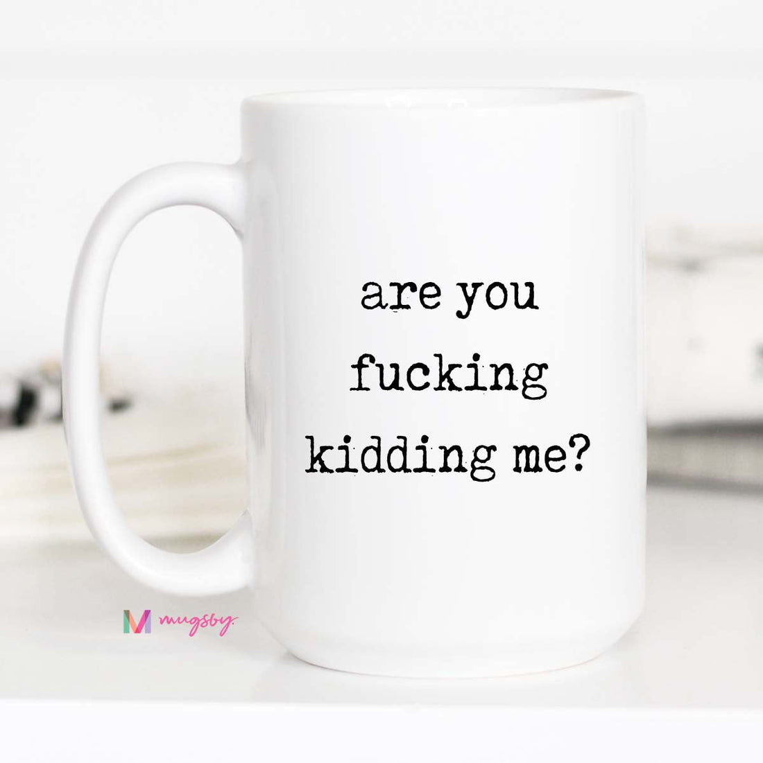 White mug with black text &