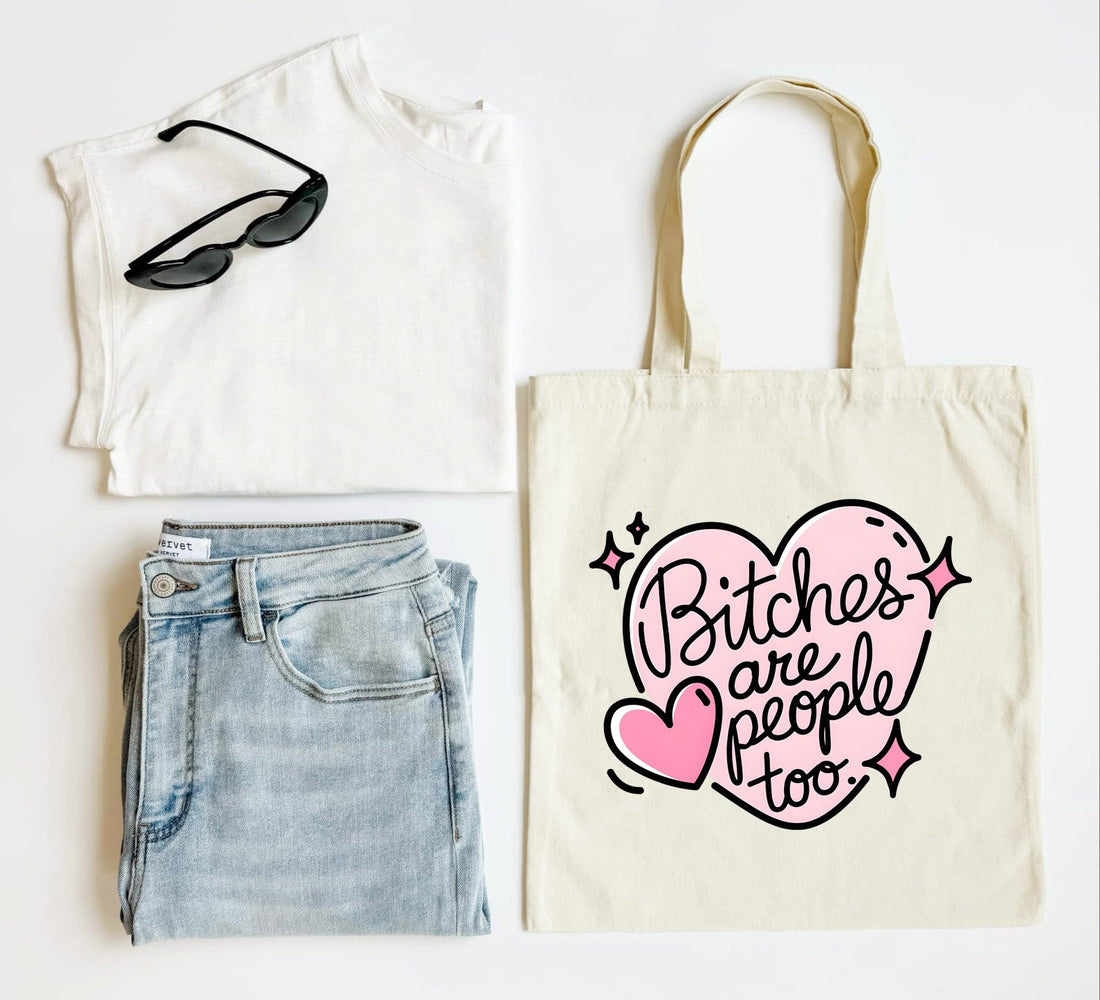 White tank top, blue jeans, black sunglasses, and a tote bag with &
