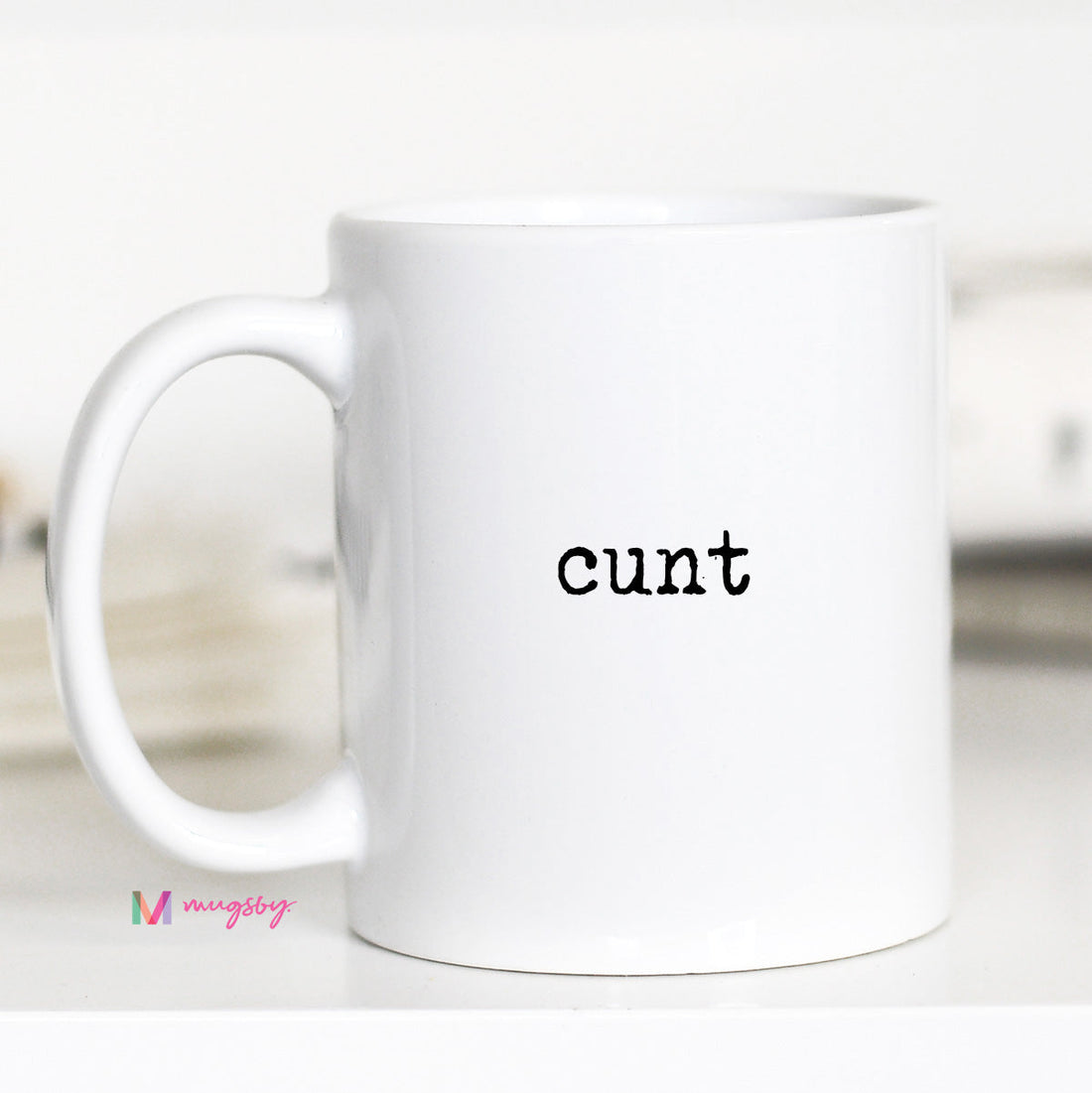 White mug with the word &