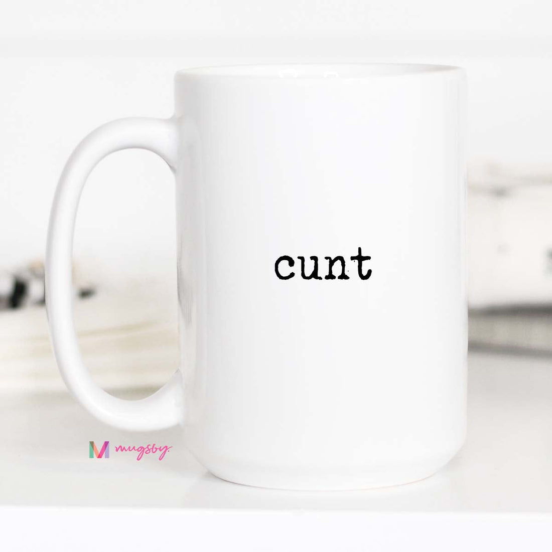 White mug with the word &