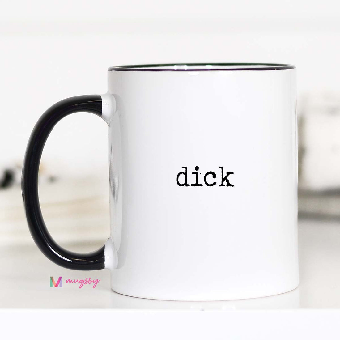 White mug with black handle and &