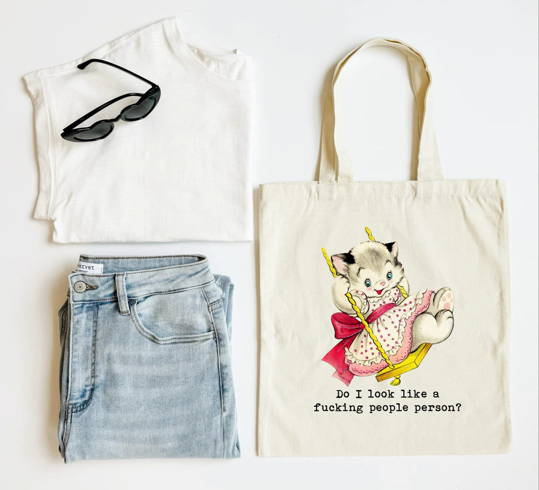 White tank top, blue jeans, sunglasses, and a tote bag with a cat illustration on a white background