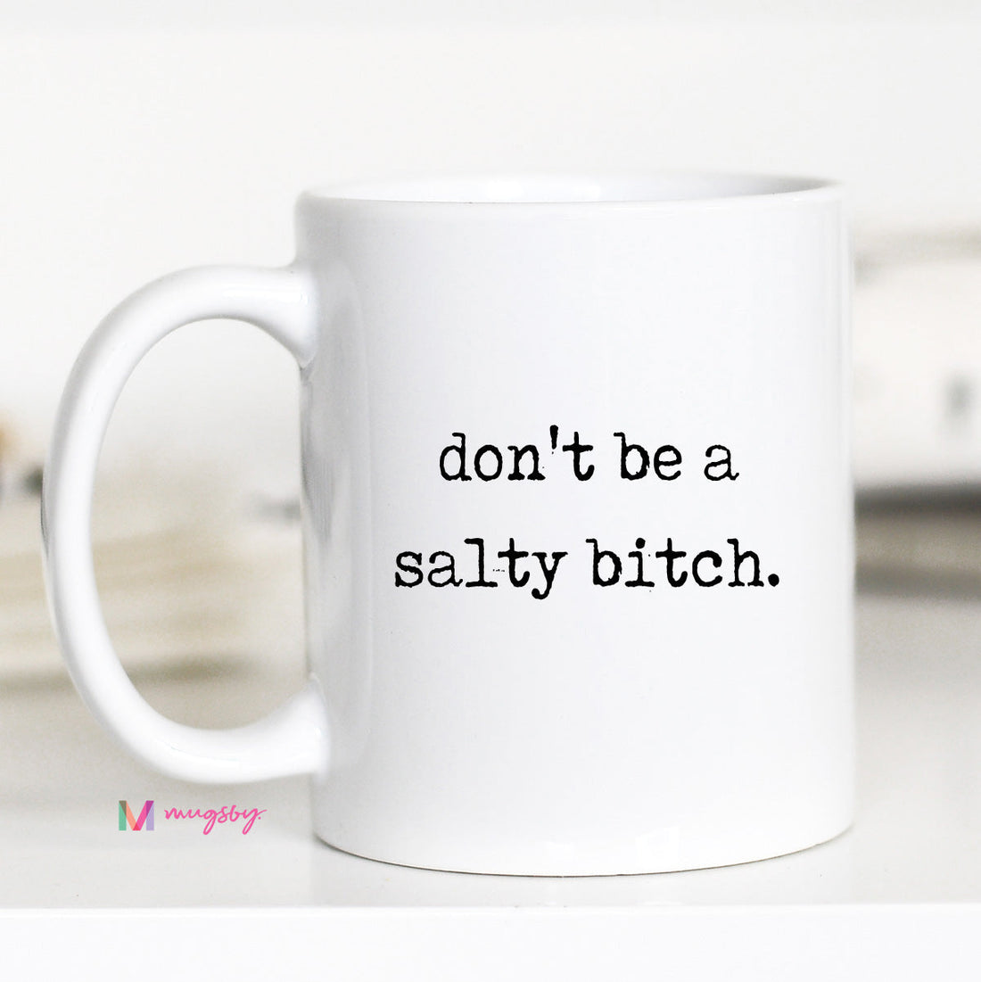 White mug with text &