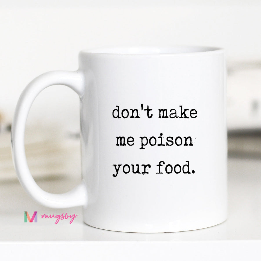 White mug with text 'don't make me poison your food.' on a white background