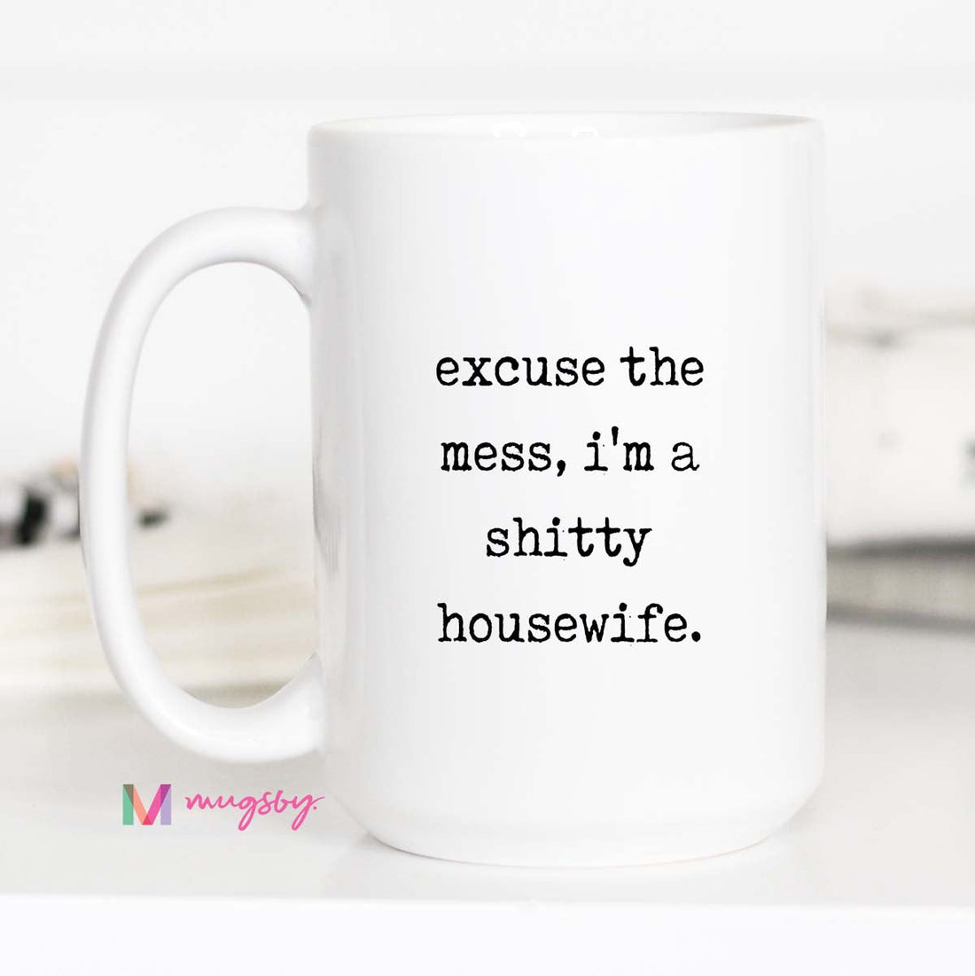 White mug with text &