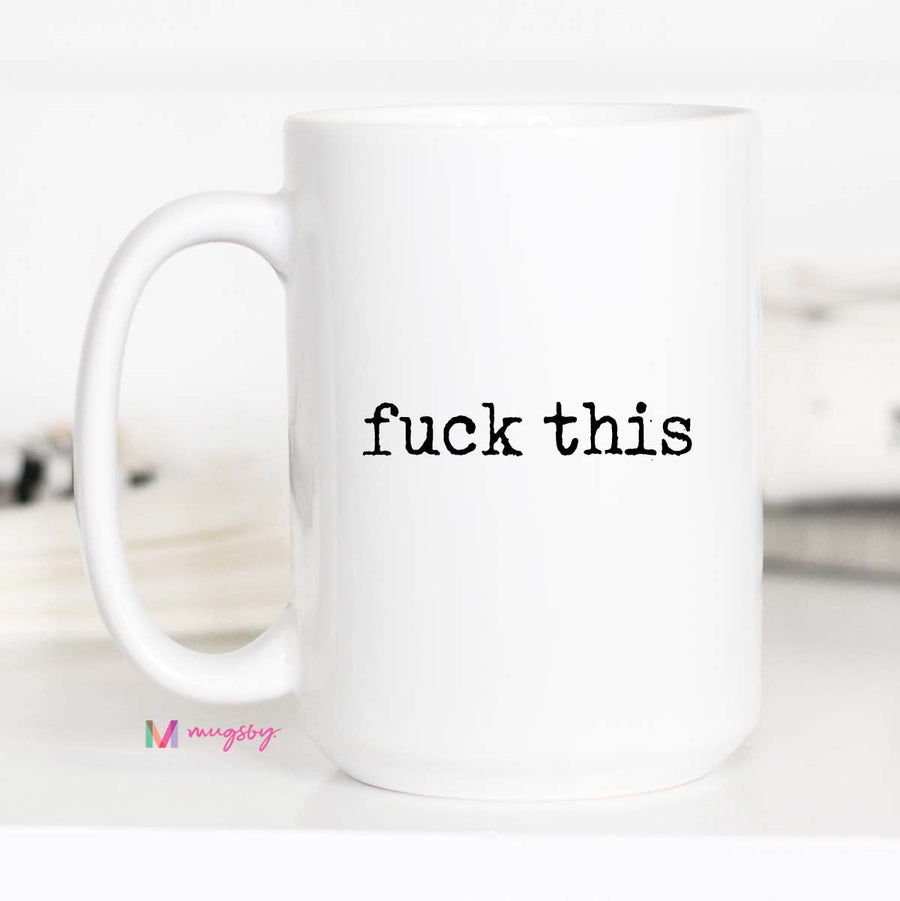 White mug with 'fuck this' text on a white background