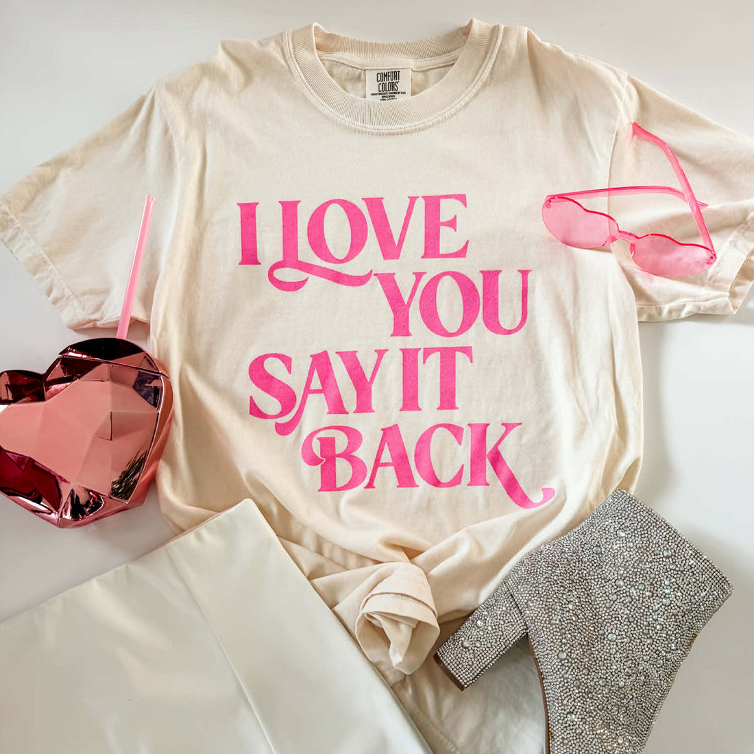 Beige t-shirt with pink text &