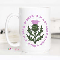 White mug with a thistle design and text on a white background