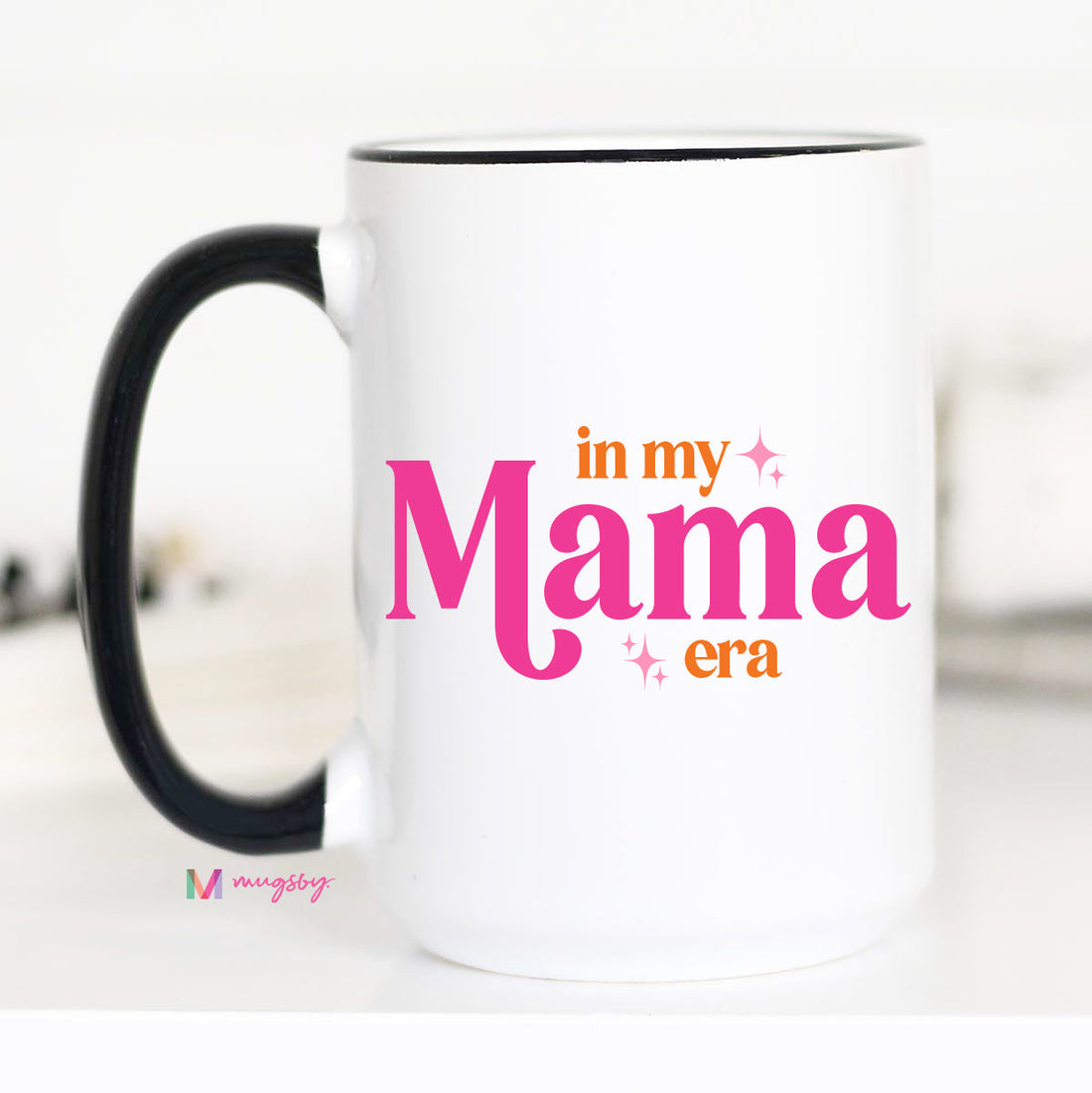 White mug with black handle featuring &