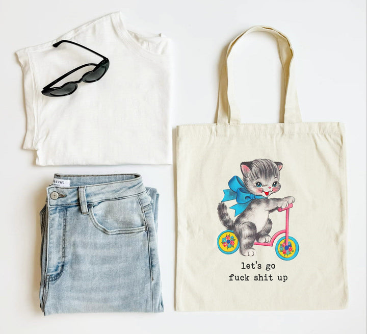 White tank top, blue jeans, sunglasses, and a tote bag with a cat illustration on a white background