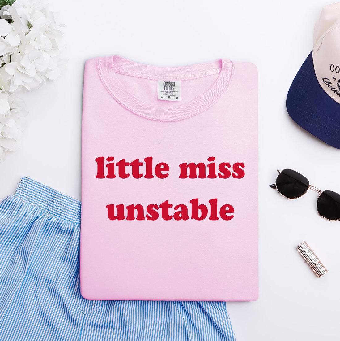 Pink graphic tee that says &