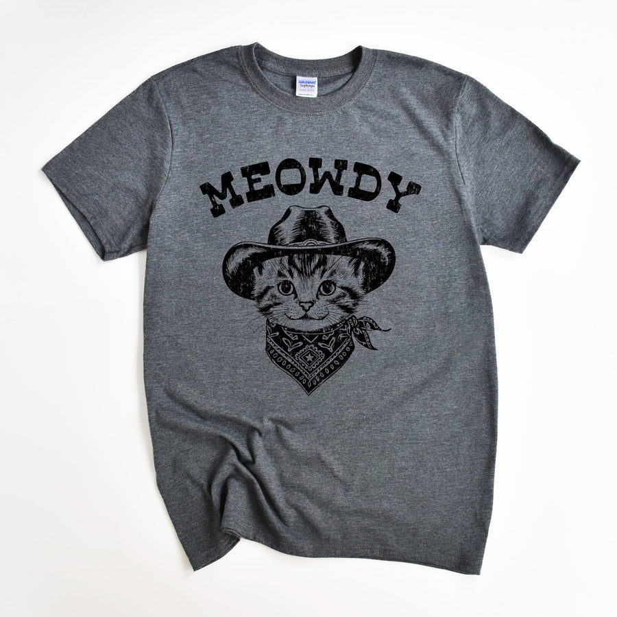 A gray t-shirt with a graphic print of a cowboy cat wearing a hat and bandana, and the text 'MEOWDY' across the front.