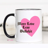 White mug with pink heart and black text on a white background