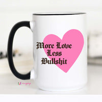 White mug with pink heart and black text on a white background