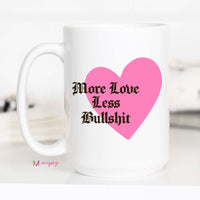 White mug with pink heart and black text on a white background